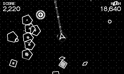 Gameplay: a swarm of pentagons converging while a powerup core drifts in